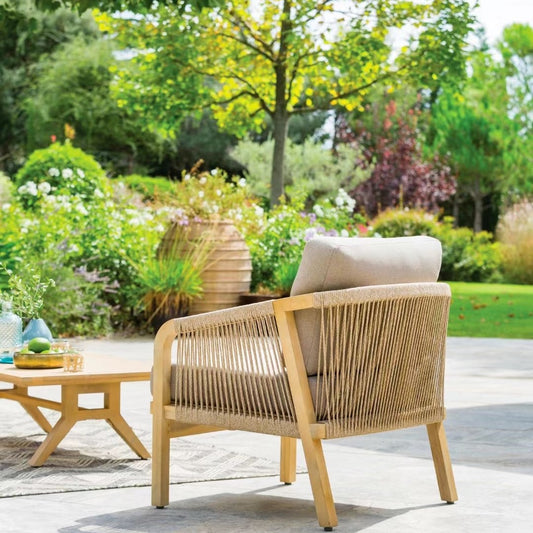 Tranquil Garden Retreat: Wooden Outdoor Chair with Beige Cushion